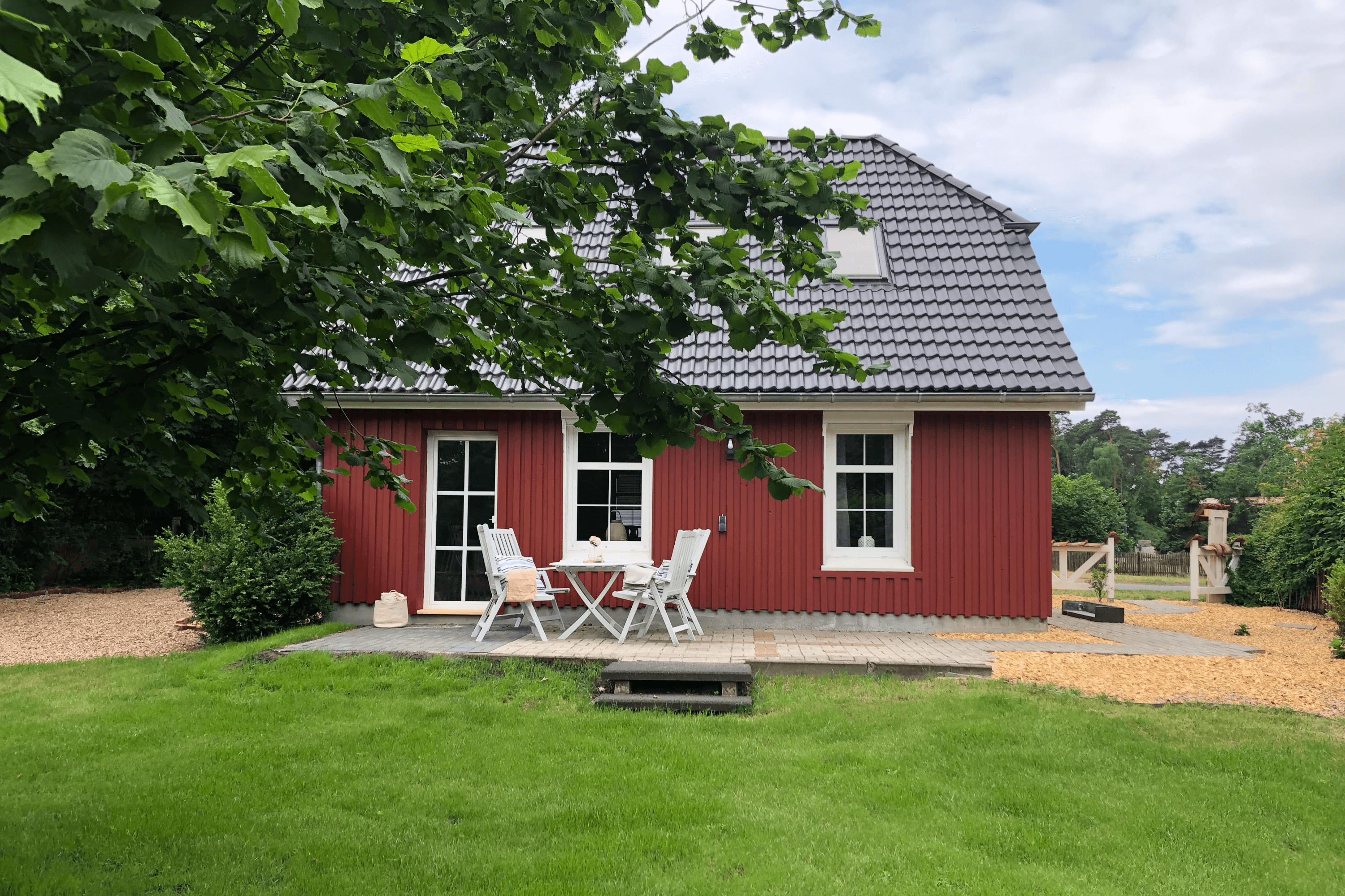 Garten Hausansicht des Ferienhauses Lütt hus in Wietze